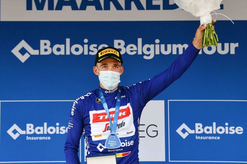 MAARKEDAL BELGIUM JUNE 15 Mads Pedersen of Denmark and Team Trek Segafredo celebrates winning the Blue Leader Jersey on the podium ceremony after the 91st Baloise Belgium Tour 2022 Stage 1 a 165km stage from Merelbeke to Merelbeke BaloiseBelgiumTour on June 15 2022 in Maarkedal Belgium Photo by Luc ClaessenGetty Images
