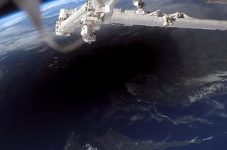 The shadow of the moon seen from the International Space Station during a total solar eclipse. It's possible for viewers on the ground to see the shadow approach and recede. This image was captured on March 29, 2006, and shows the shadow across southern Turkey, Northern Cyprus and the Mediterranean Sea.