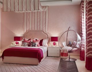 Pink teen girls bedroom with hanging bubble chair