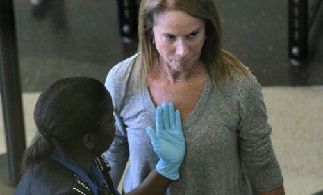 A passenger gets a pat-down after going through the full-body scan at O&amp;#039;Hare airport in Chicago. The TSA is reportedly making small changes to the new rules.