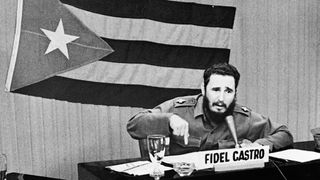 A black and white photo of Fidel Castro giving a speech