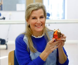 Sophie, Countess of Wessex makes a chocolate robin sculpture during a visit to Disability Initiative to mark the UN International Day of Persons with a Disability on December 1, 2021 in Camberley, England. During her visit The Countess took part in a music and drama session and Christmas chocolate sculpture and Christmas wreath making workshops.