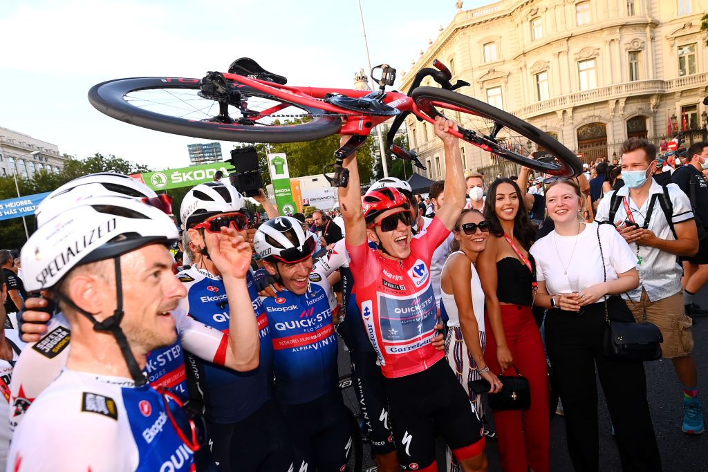 MADRID SPAIN SEPTEMBER 11 Remco Evenepoel of Belgium Red Leader Jersey and Team QuickStep Alpha Vinyl celebrate the victory of the race during the 77th Tour of Spain 2022 Stage 21 a 967km stage from Las Rozas to Madrid LaVuelta22 WorldTour on September 11 2022 in Madrid Spain Photo by Tim de WaeleGetty Images