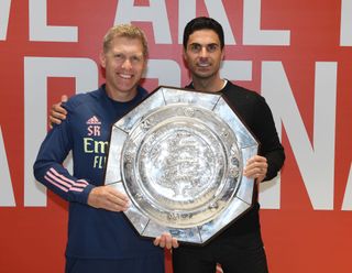 Arsenal Head Coach Mikel Arteta lifts the FA Community Shield with assistant Steve Round after the FA Community Shield match between Arsenal and Liverpool at Wembley Stadium on August 29, 2020 in London, England.