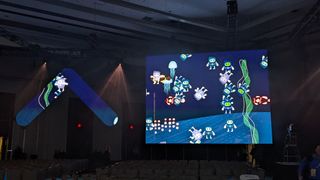 SuiteWorld 2023 aquatic theme screen with fish.
