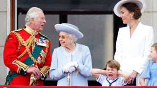 Prince Charles, Prince of Wales, Queen Elizabeth II, Prince Louis of Cambridge and Catherine, Duchess of Cambridge watch a flypast from the balcony of Buckingham Palace during Trooping the Colour on June 2, 2022 in London, England