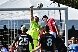 Wrexham's goalkeeper Callum Burton (C) clears the ball during the club pre-season friendly match between Wrexham AFC and AFC Bournemouth at Harder Stadium in Santa Barbara, California, on July 20, 2024.