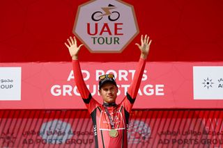 KHALIFA PORT UNITED ARAB EMIRATES FEBRUARY 21 Lucas Plapp of Australia and Team INEOS Grenadiers celebrates at podium as Red Leader Jersey winner during the 5th UAE Tour 2023 Stage 2 a 173km team time trial in Khalifa Port UAETour on February 21 2023 in Khalifa Port United Arab Emirates Photo by Dario BelingheriGetty Images