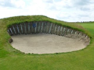 The rebuilt Sarazen Bunker protects the 9th green on the Himalayas