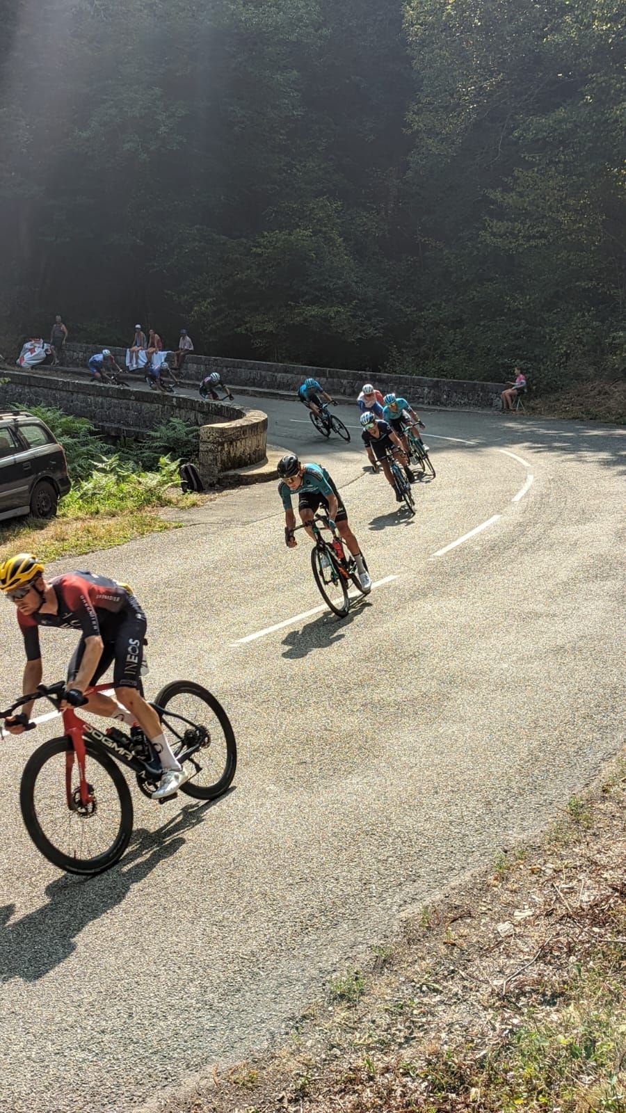 Riders exit a turn at the 2022 Toru de France