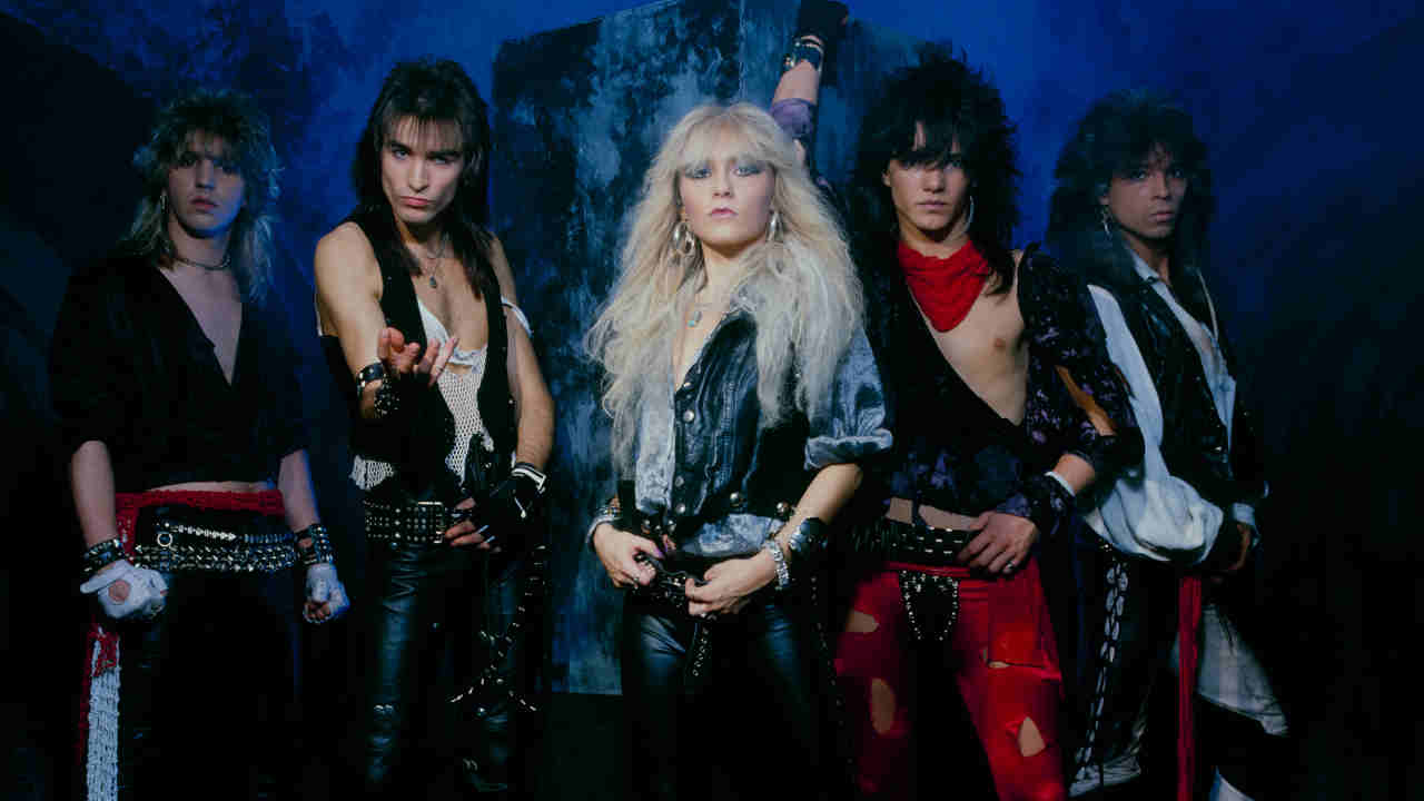 Warlock posing for a photograph in the 1980s