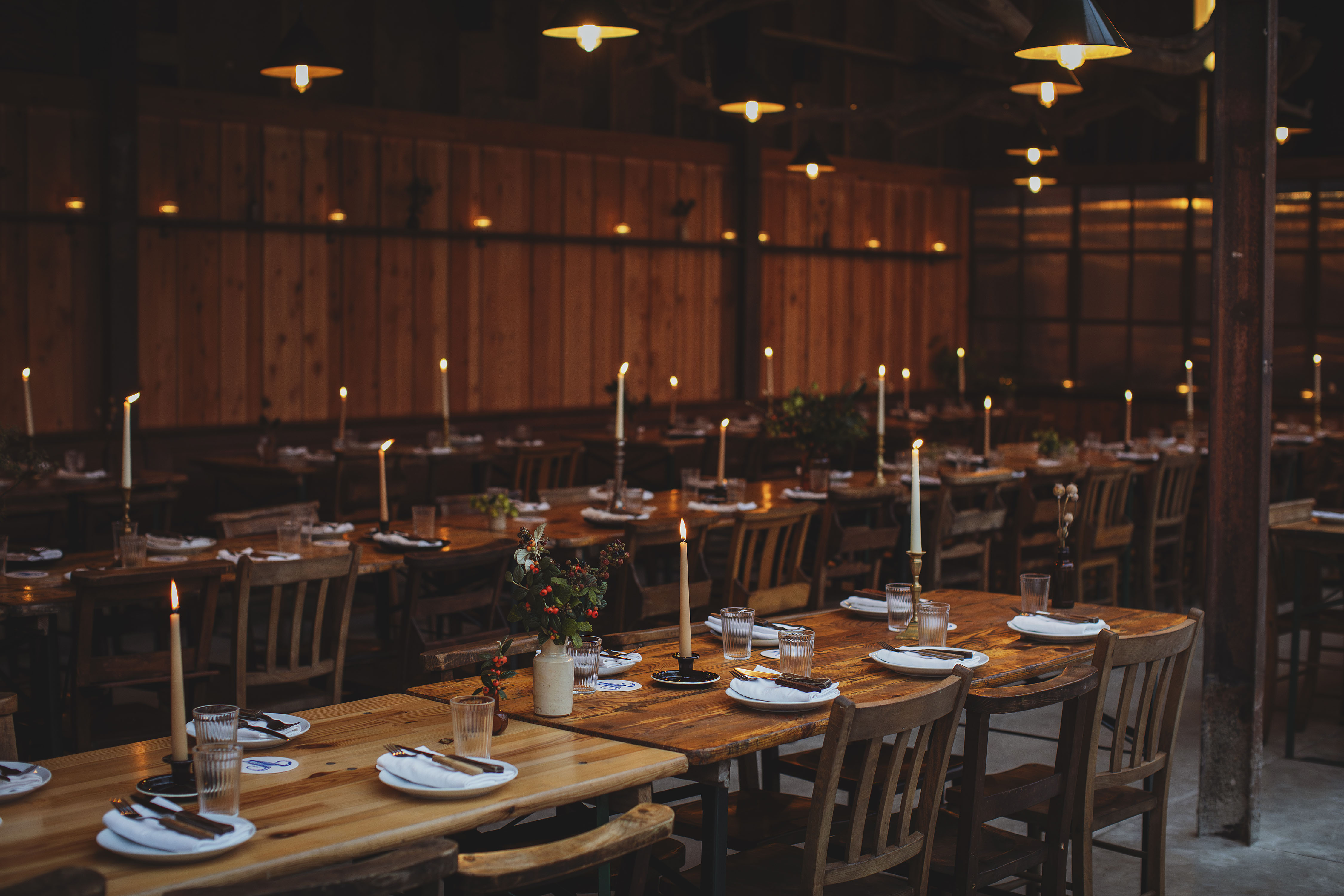Dining tables in a rustic barn