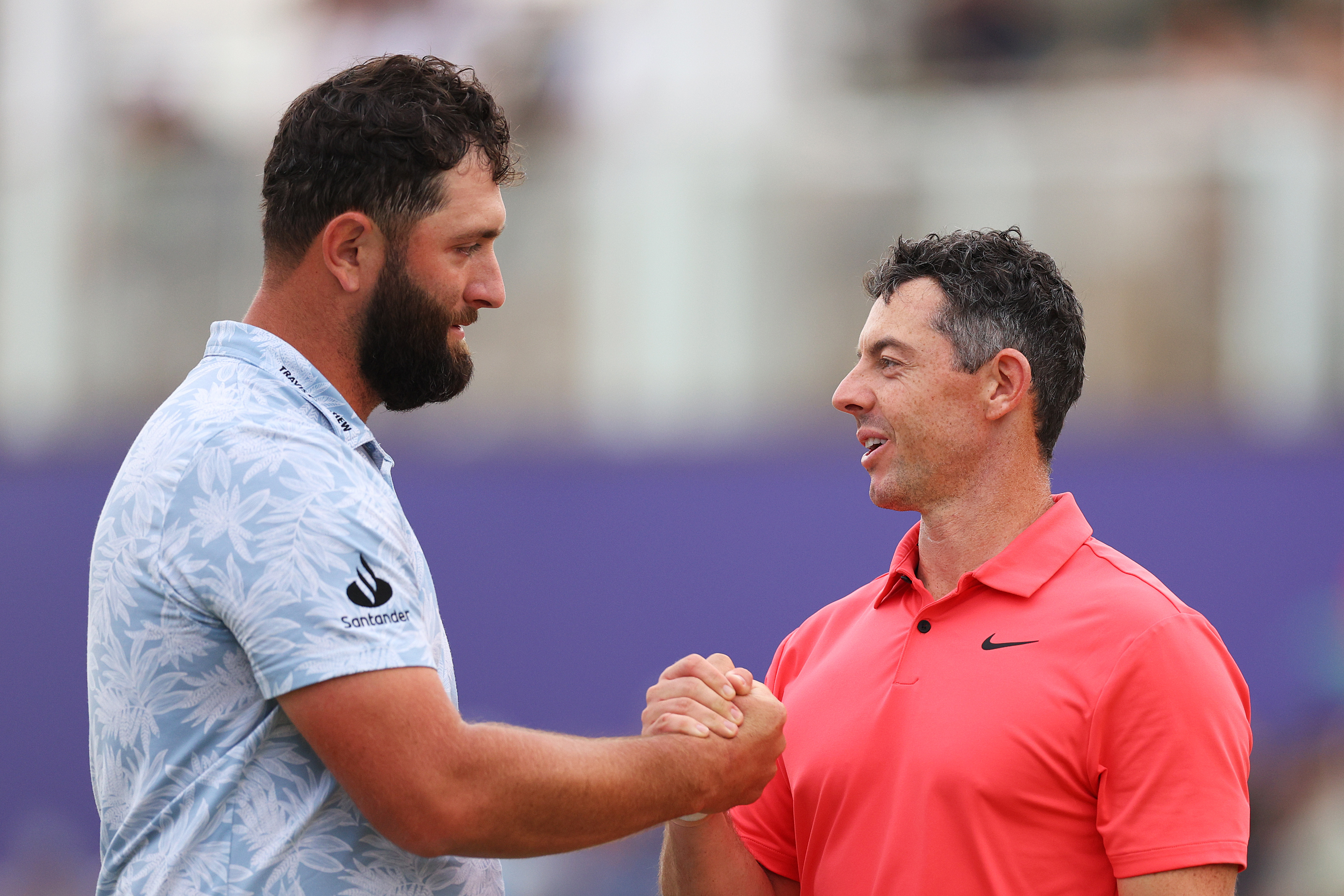 Jon Rahm and Rory McIlroy shake hands