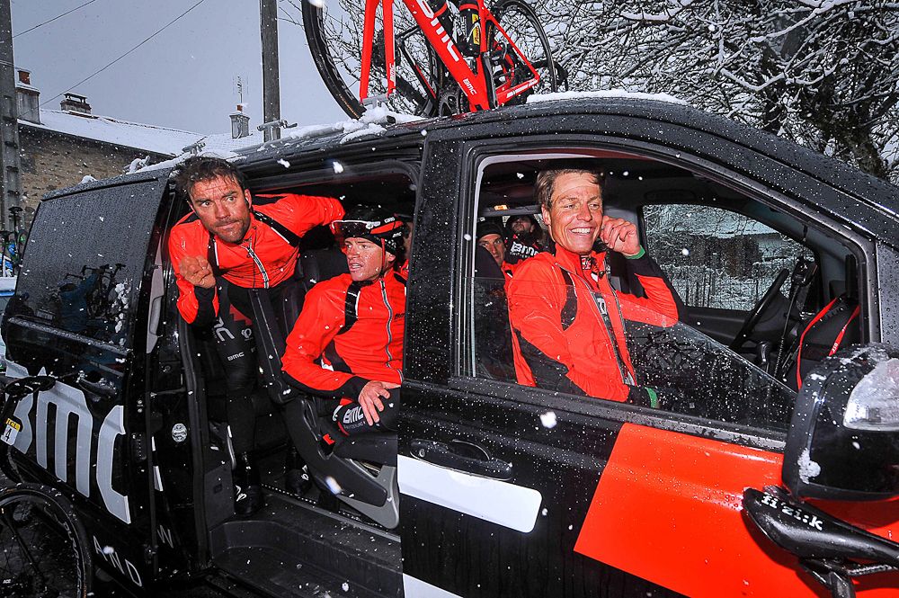 Amael Moinard, Ben Hermans and Michael Schar warm up in the BMC team vehicle.