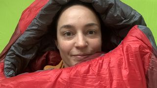Staff writer Julia Clarke testing out the Rab Solar Eco 3 sleeping bag