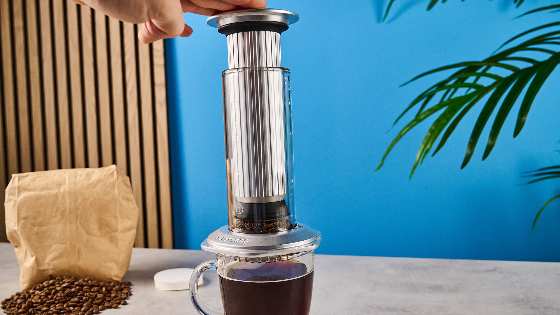 a glass AeroPress premium with aluminum flourishes 