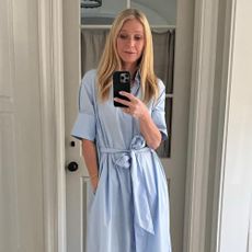 Gwyneth Paltrow styles a blue dress.