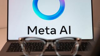 A Meta AI logo on a laptop with a pair of Ray-Ban Meta Smart Glasses in front