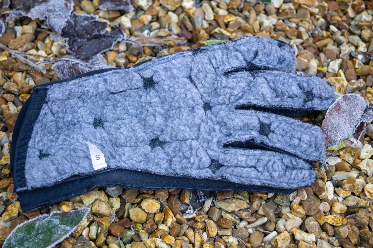 An inside out Q36.5 Termico glove on some gravel