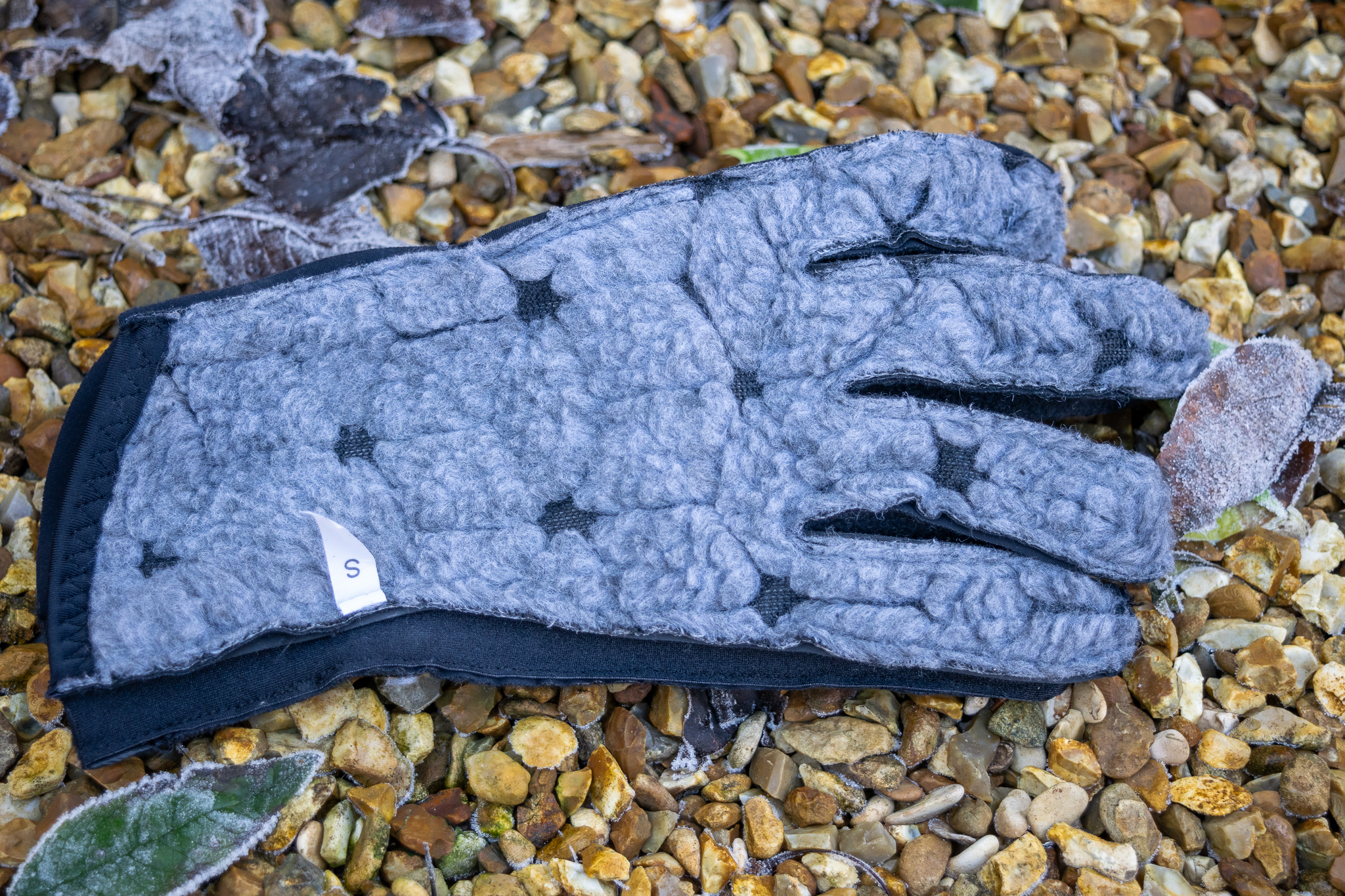 An inside out Q36.5 Termico glove on some gravel  