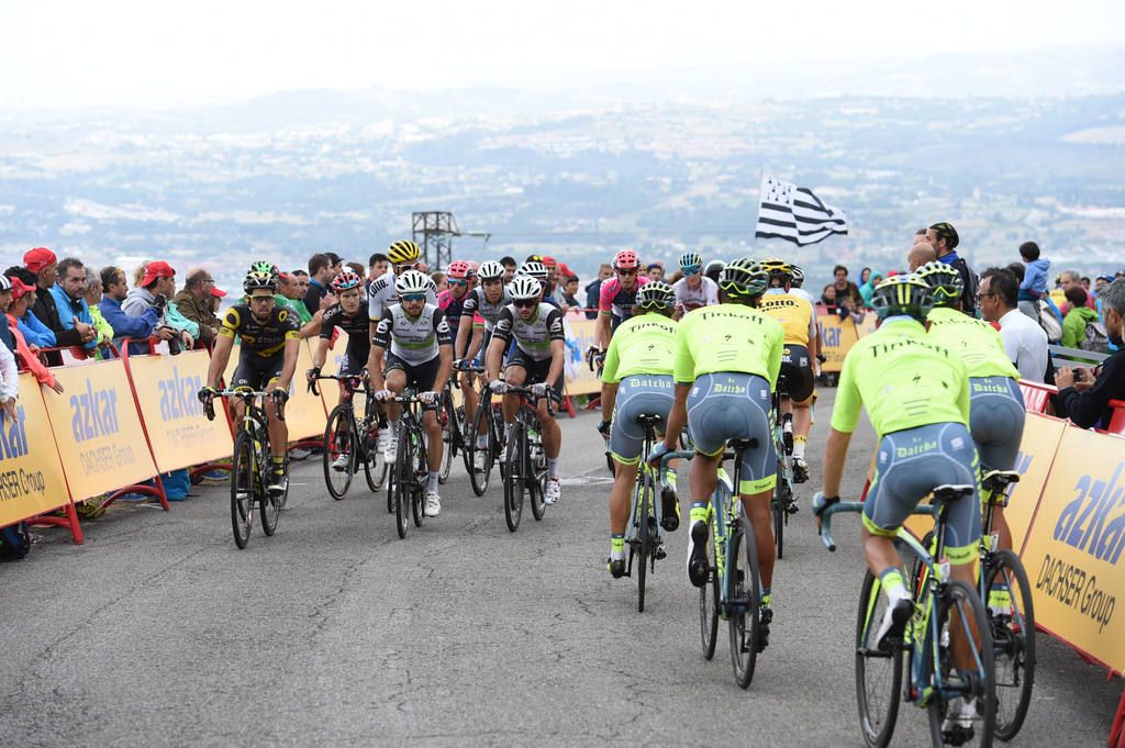The Tinkoff riders head down the climb as the grupetto come in