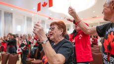 A woman waving a Canada flag after the separation referendum was lost
