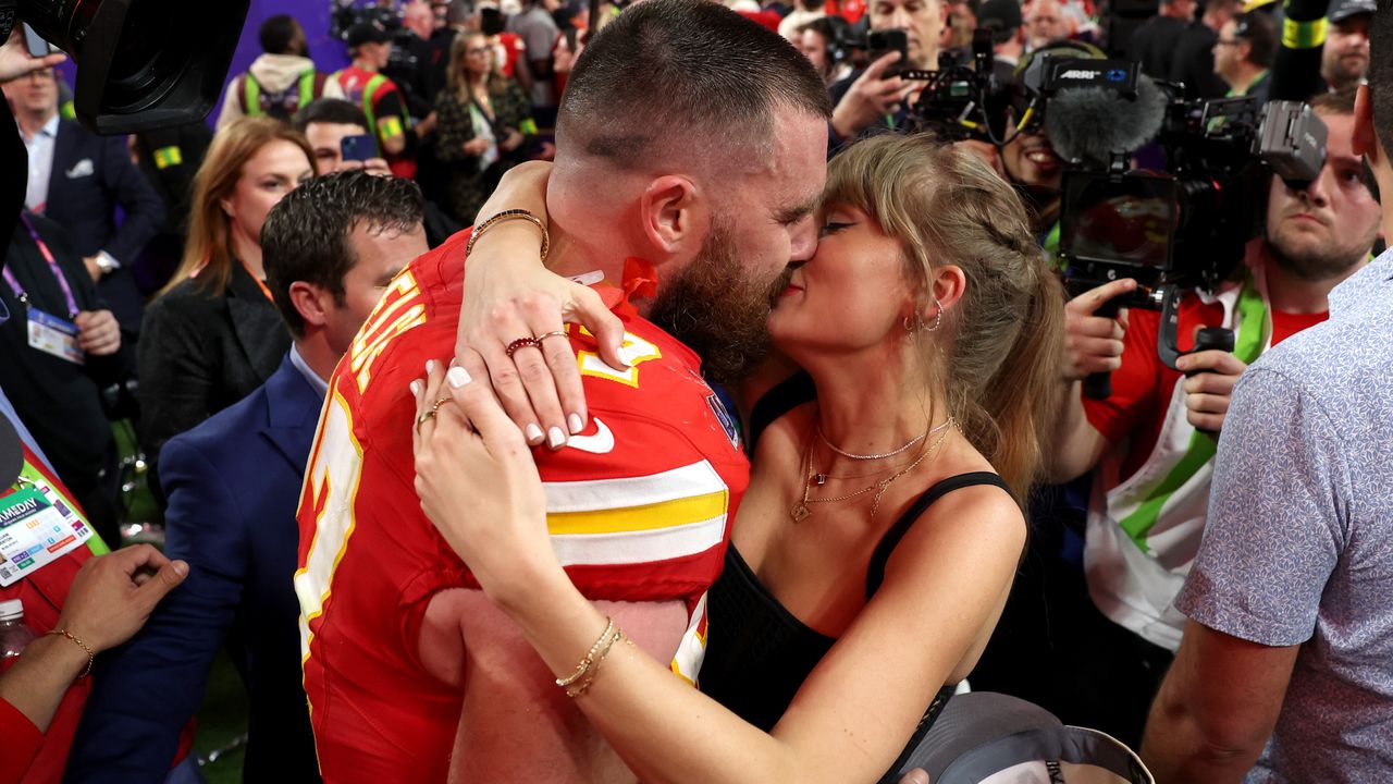  Travis Kelce #87 of the Kansas City Chiefs and Taylor Swift embrace after defeating the San Francisco 49ers in overtime during Super Bowl LVIII at Allegiant Stadium on February 11, 2024.