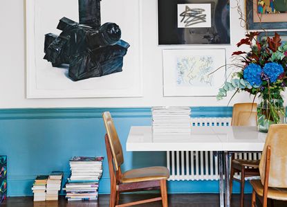 living room with blue skirting trim and white walls