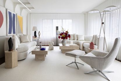 Andrew Suvalsky Designs apartment at Park Avenue with white living room and Midcentury art