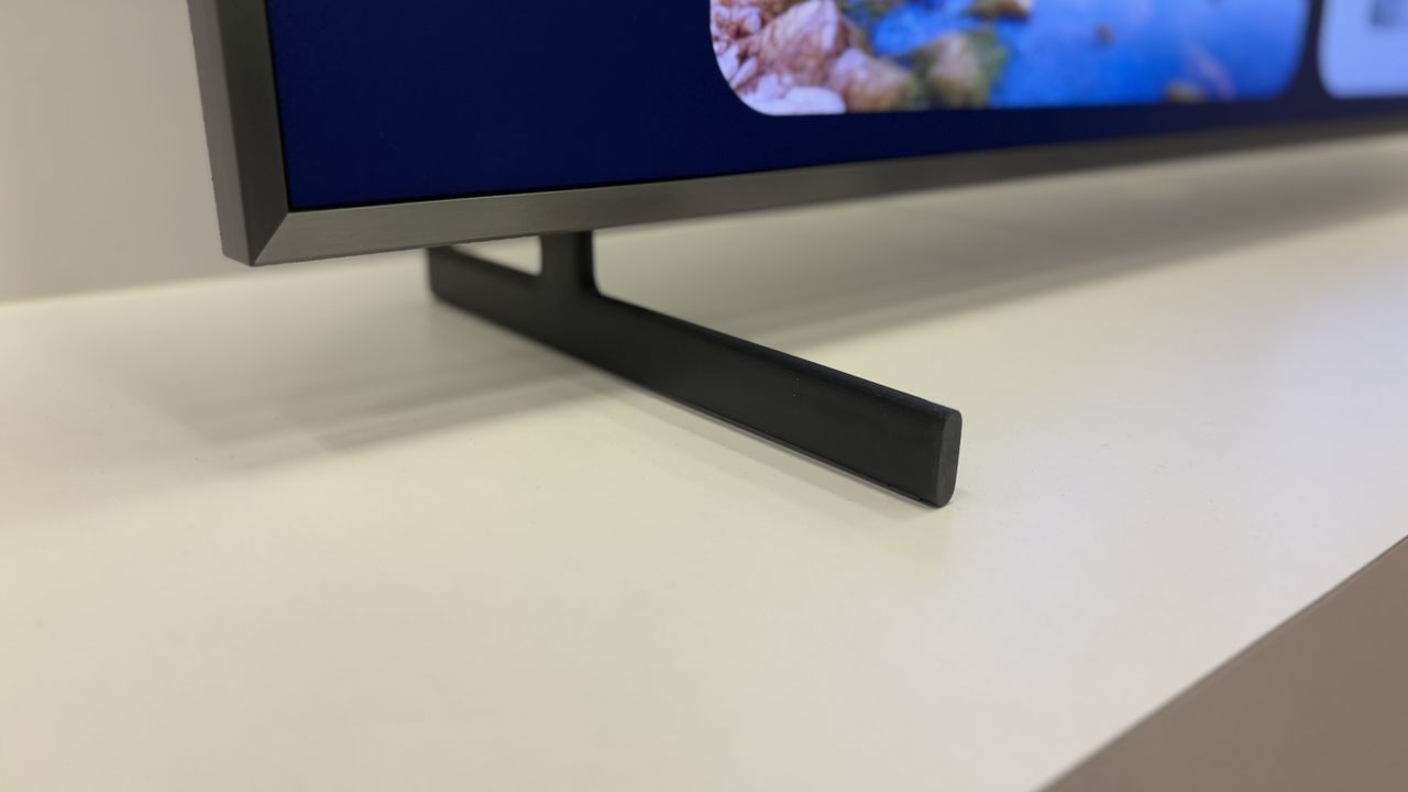 Samsung Q900F TV on a white stand at Samsung's CES 2025 showcase