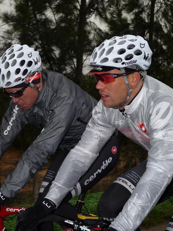 Thor Hushovd and Brett Lancaster are dressed for the rain.