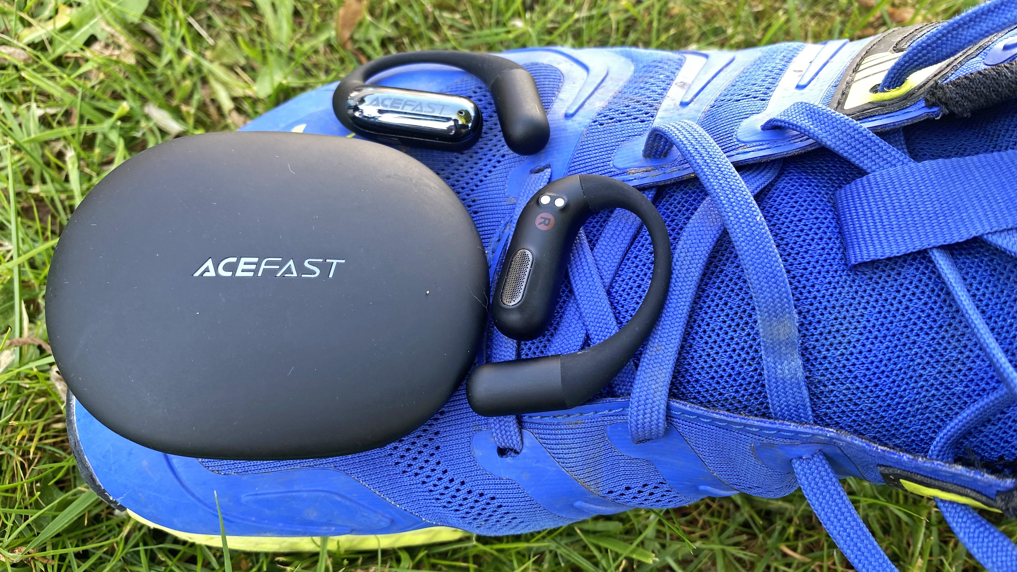 AceFast AceFit Earbuds pictured on a running shoe