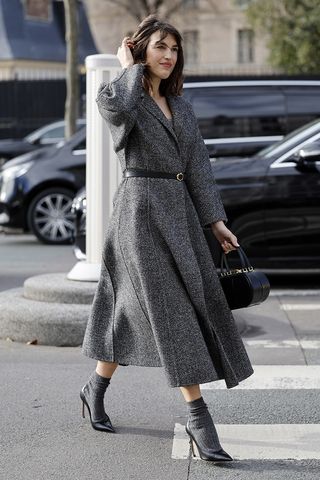 Jeanne Damas weairng a tweed coat in Paris