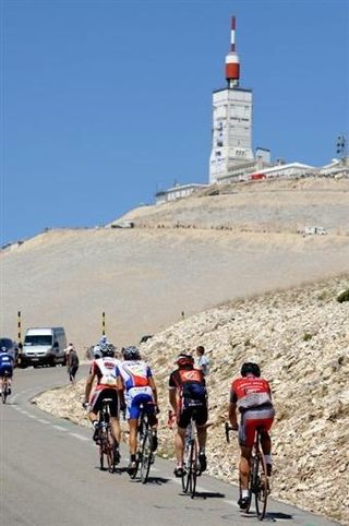 A small group of riders near the top of their ascent up Mont Ventoux.