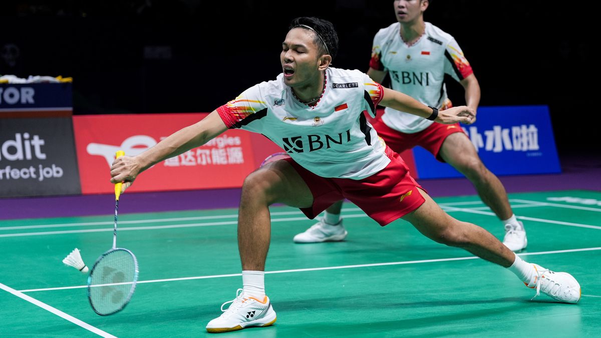 Fajar Alfian plays a shot at the Thomas &amp; Uber Cup badminton 2024