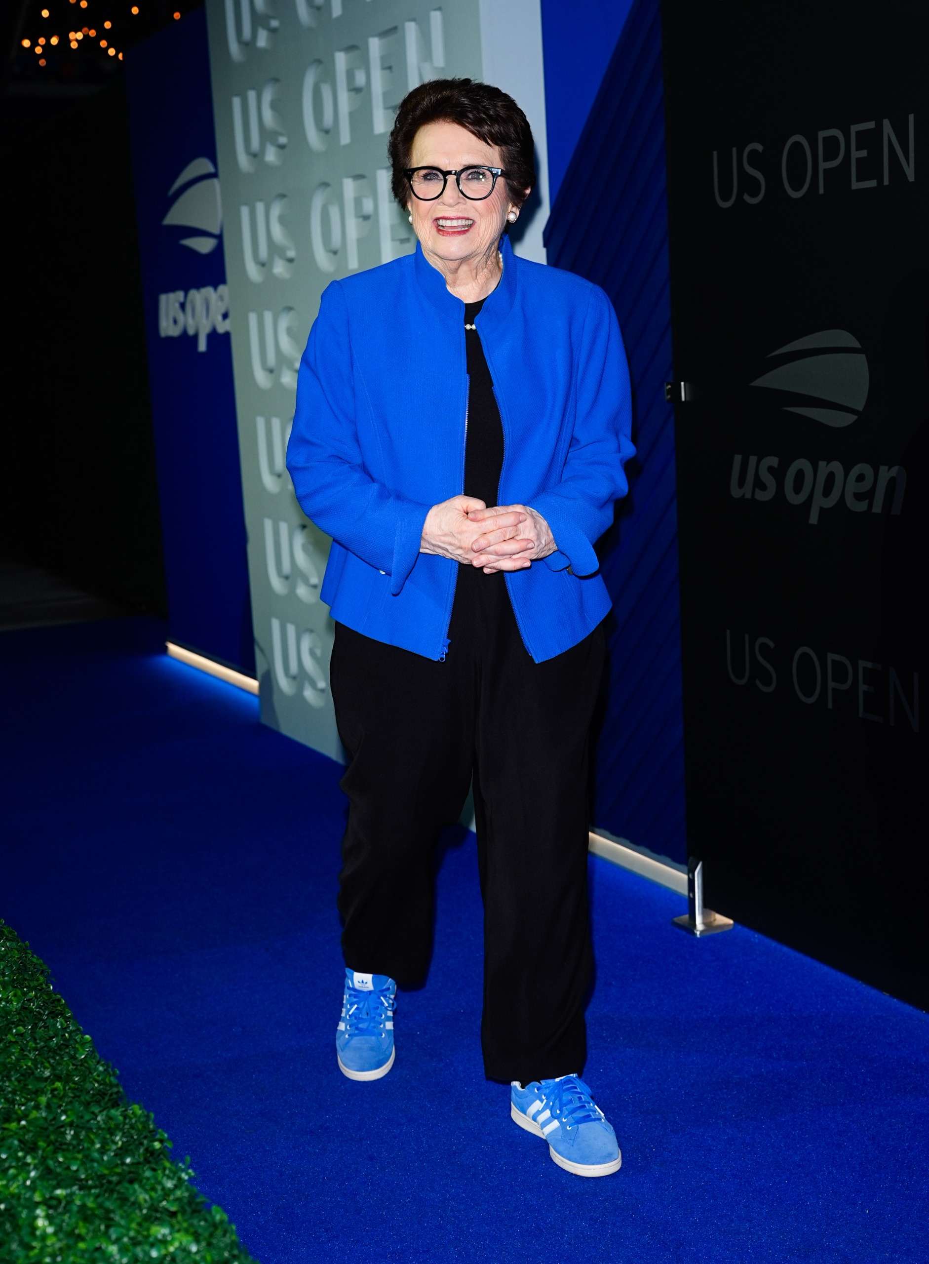 Billie Jean King styled a cobalt blue jacket with Adidas sneakers at the 2026 US Open
