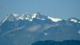 photo showing several snow covered peaks in the Sierra Nevada de Santa Marta mountains in Colombia.