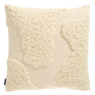 cream pillow with tufted detail