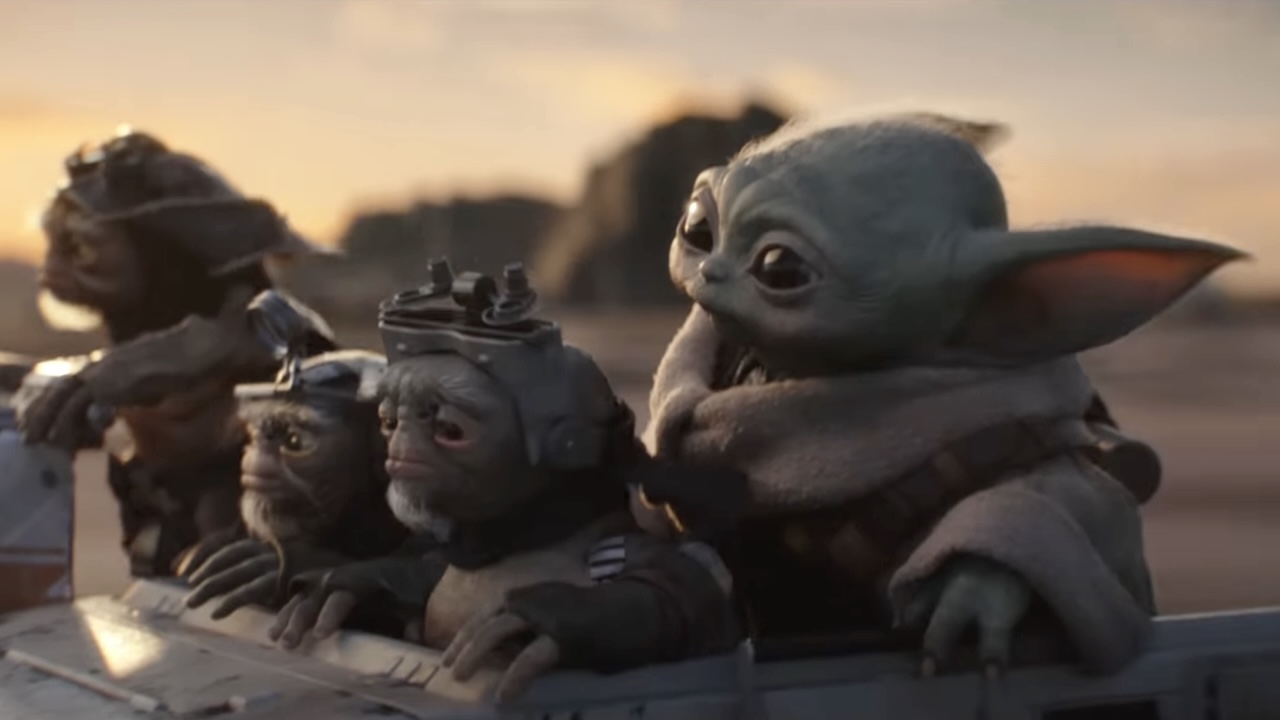 Grogu riding in a speeder with some Anzellans in The Mandalorian and Grogu