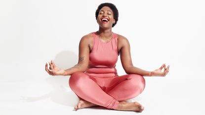 Woman wearing sportswear practicing laughter yoga