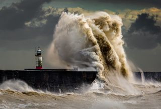 Wave breaking over the jetty at Newhaven during a storm