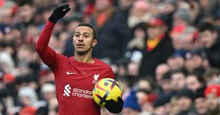 Liverpool midfielder Thiago Alcantara prepares to throw during the English Premier League football match between Liverpool and Chelsea at Anfield in Liverpool, north west England on January 21, 2023.