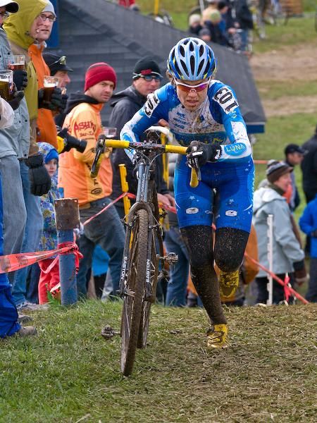 Georgia Gould (Luna Pro Team) makes her way past a line of beer toting spectators on the way to victory.