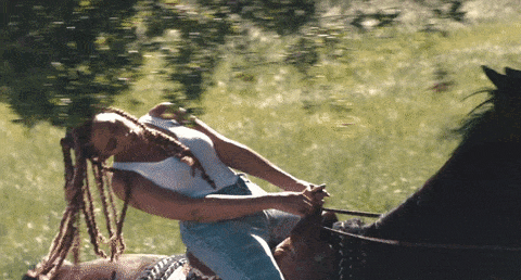 Beyonce riding a horse