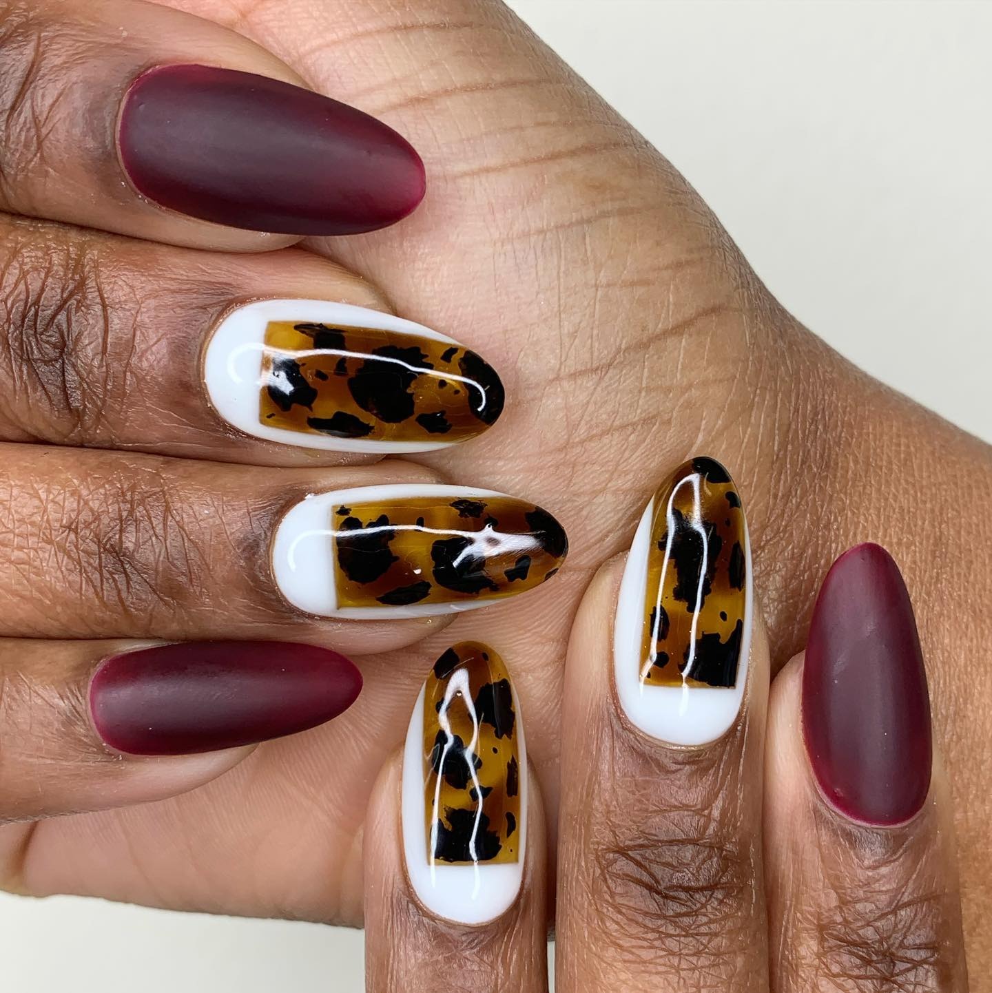 Burgundy tortoiseshell nails