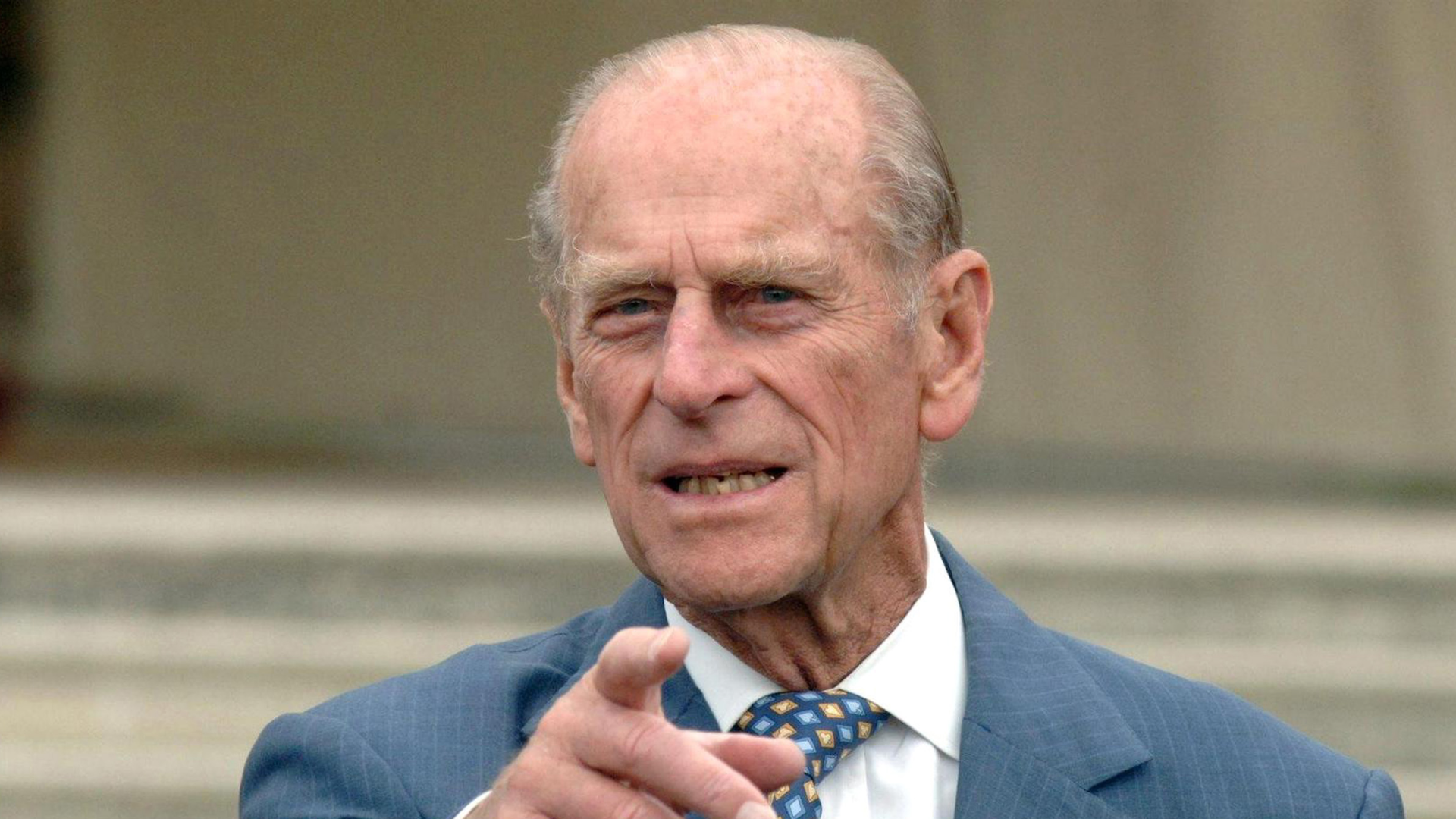 Prince Philip points at the camera while he meets guests in the gardens of Buckingham Palace to celebrate the 50th anniversary of the Duke of Edinburgh's Award scheme on July 13, 2006