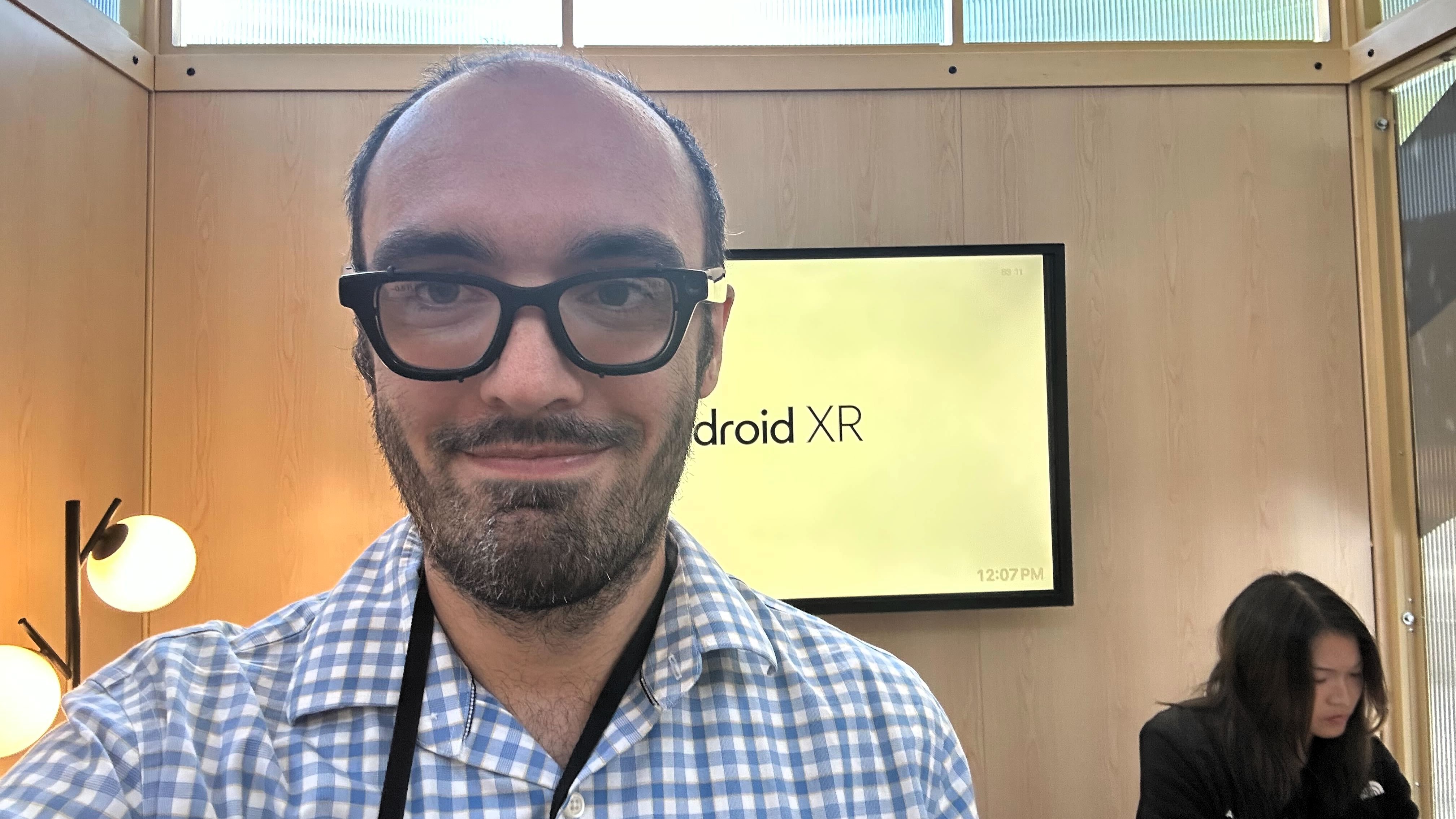 Michael Hicks wearing Android XR prototype glasses