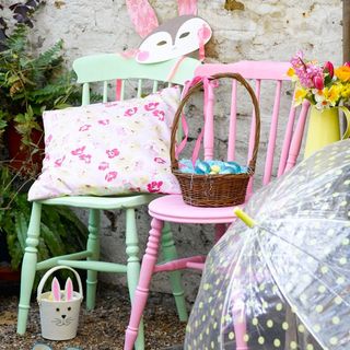 colourful chairs with basket and flower vase