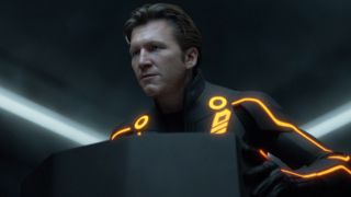 Jeff Bridges delivering a speech at a podium in Tron: Legacy.