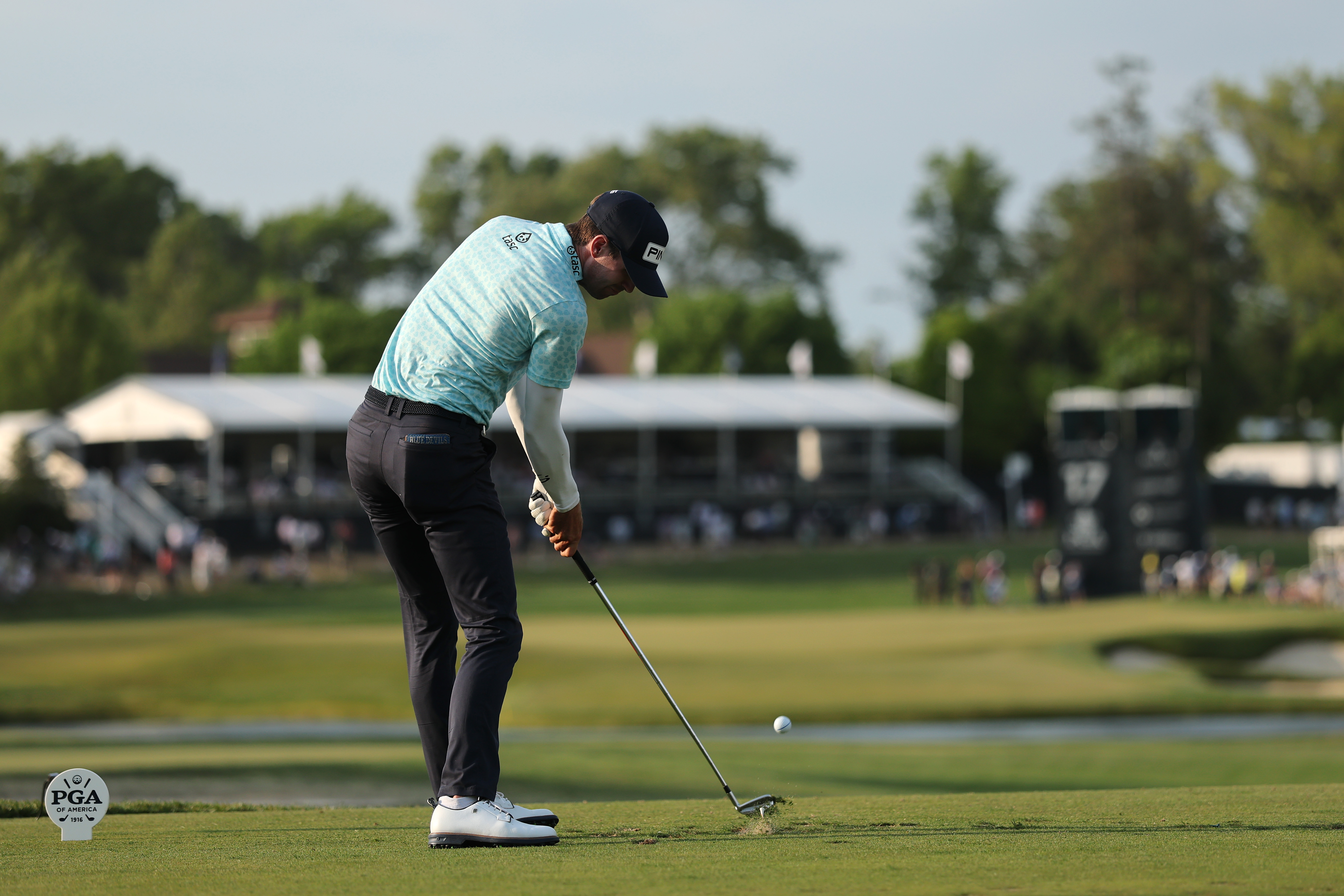 Alex Smalley of the United States hits a tee shot on the 17th hole during the third round of the PGA Championship at Aronimink Golf Club